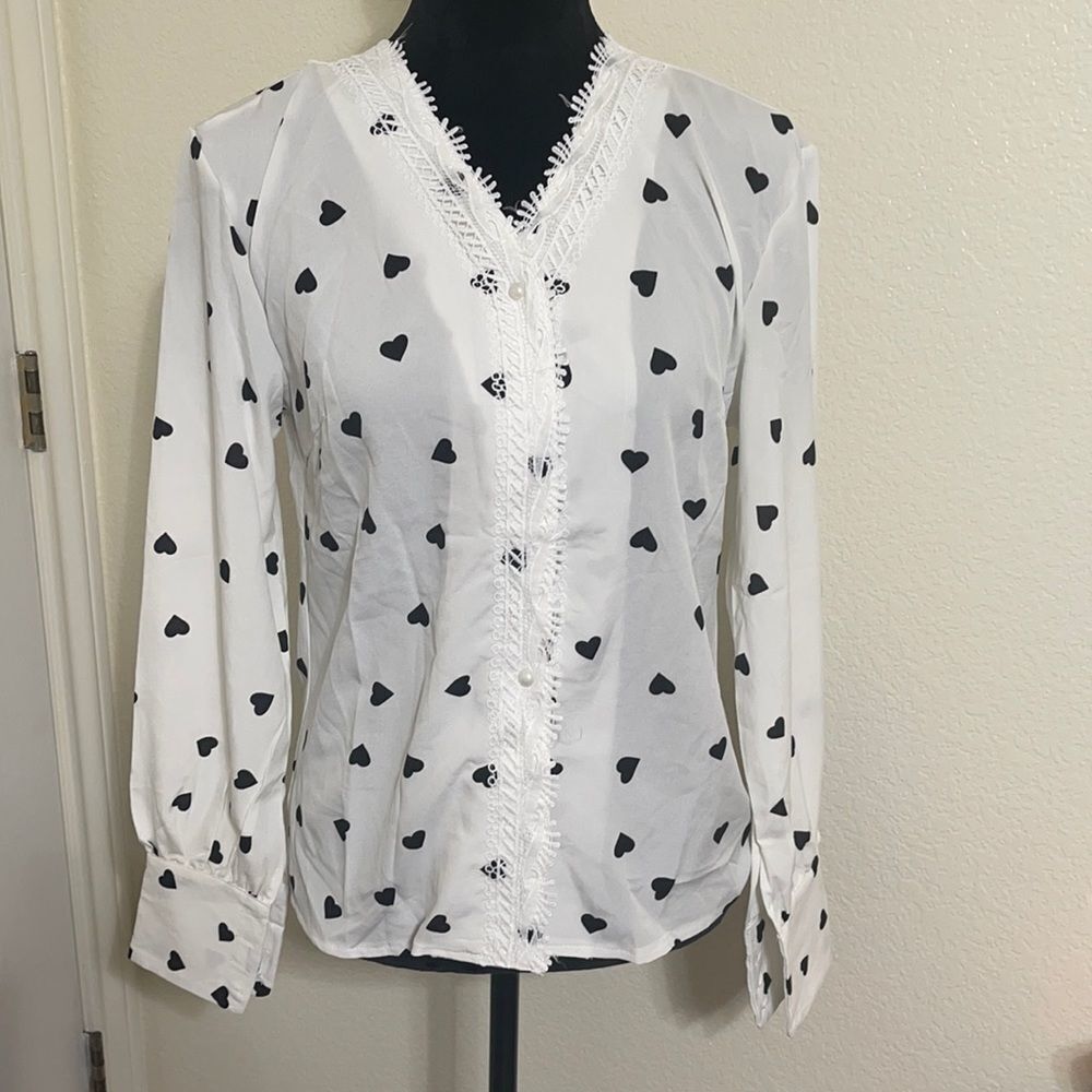 #318 New with tags Blouse with hearts button up